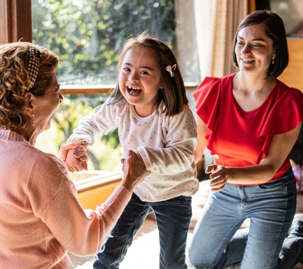 Toddler playing with two women