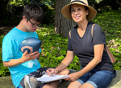 Woman and child working together on homework 