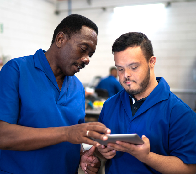 Two men holding iPad