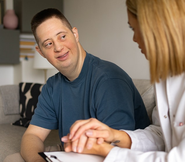 Doctor talking with adult male 