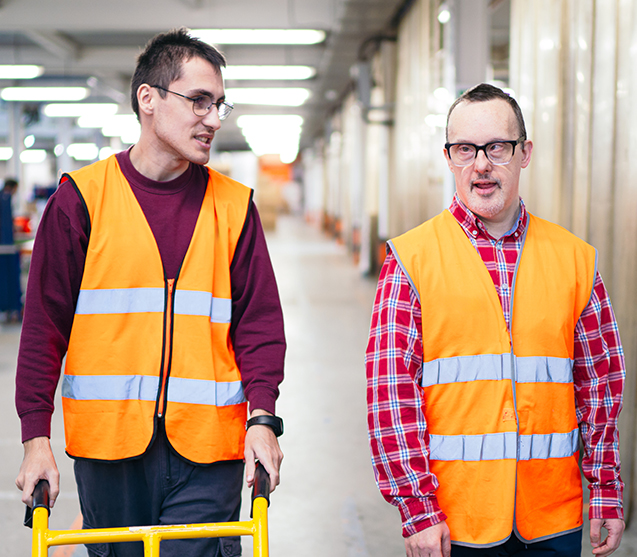 Two workers in orange safety gear 