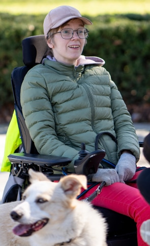 Woman in wheel chair with dog