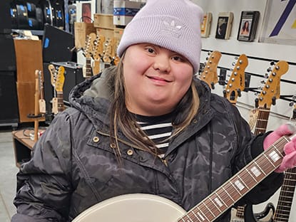 Girl smiling with instrument