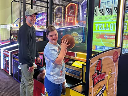 Two people playing arcade games