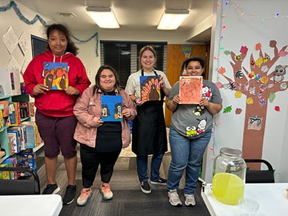 Group of people with paintings